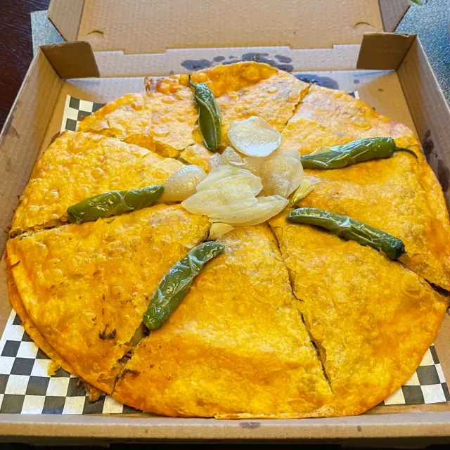 Birria pizza in box